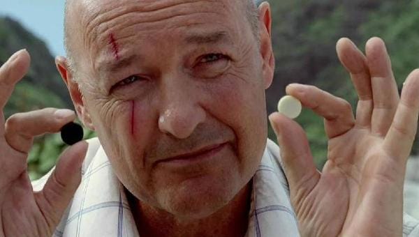 John Locke (Terry O'Quinn) holds up two stones; one black, one white.